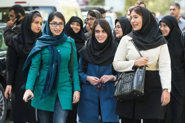 female students walking on campus university of tehran iran